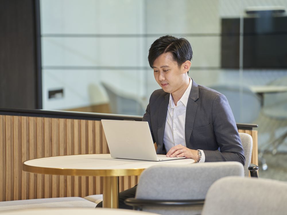 A consultant working at the Prestige Dynamic office