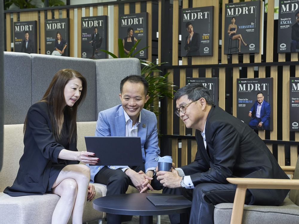 Consultants in discussion at the Prestige Dynamic office