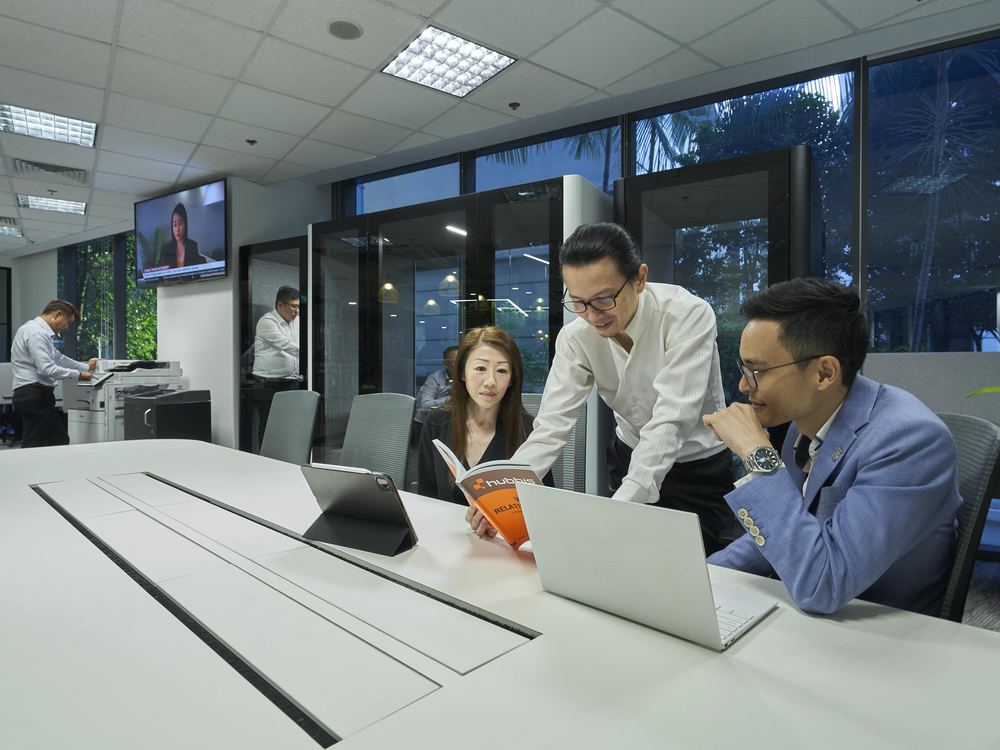 Colleagues reviewing work together at the Prestige Dynamic office